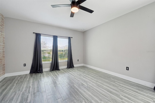 unfurnished room featuring ceiling fan and light hardwood / wood-style floors