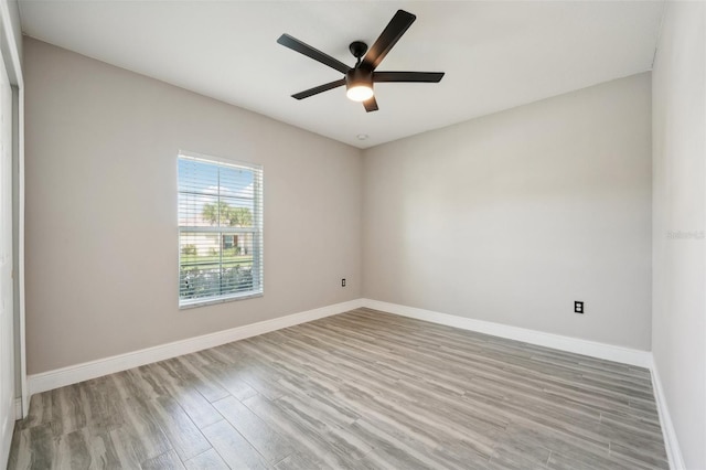 spare room featuring ceiling fan and light wood-type flooring