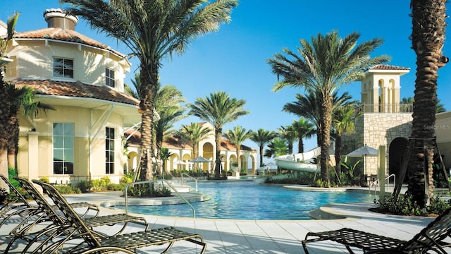 view of pool with a water slide