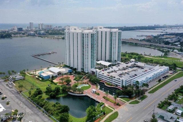 birds eye view of property with a water view