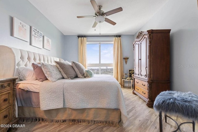 bedroom featuring light hardwood / wood-style flooring and ceiling fan