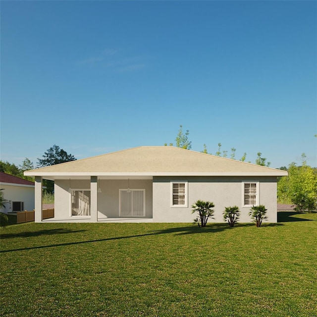 back of house with a lawn