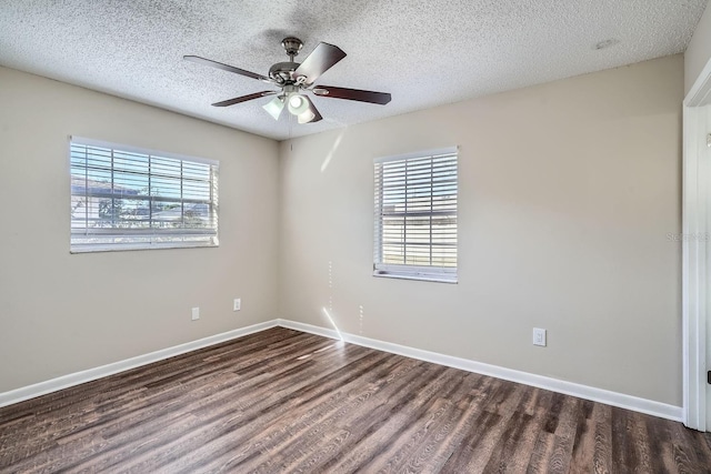 unfurnished room with a healthy amount of sunlight, ceiling fan, and a textured ceiling