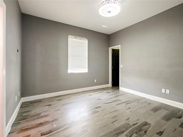 unfurnished room with light hardwood / wood-style floors