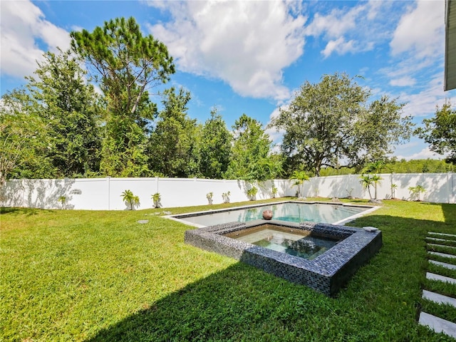 view of pool with an in ground hot tub and a yard