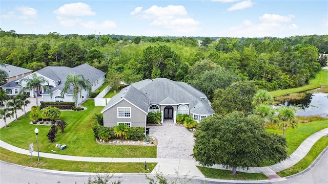 birds eye view of property with a water view