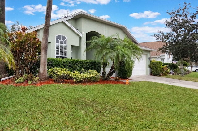 view of front of home featuring a garage and a front lawn