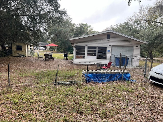 exterior space featuring a storage unit and a pool