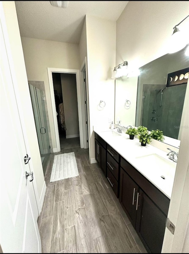 bathroom with vanity and an enclosed shower