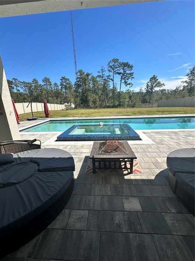 view of pool featuring a fenced in pool, a patio, a fire pit, and a fenced backyard