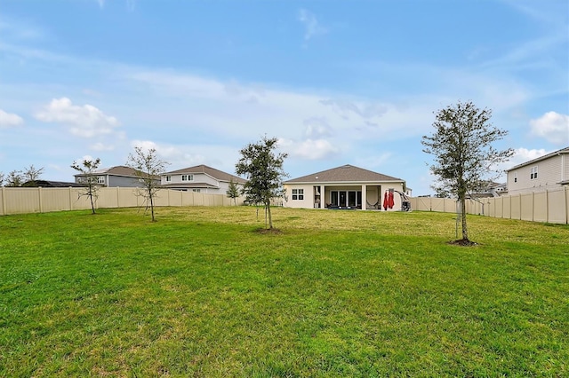 view of yard featuring a fenced backyard