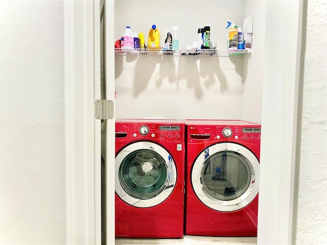 laundry area with washing machine and dryer