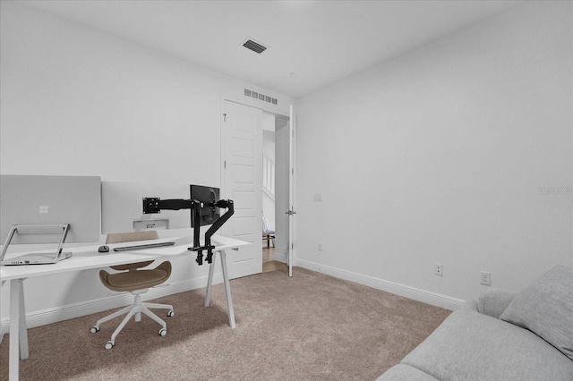 office space with light colored carpet