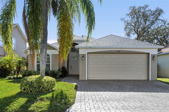 ranch-style house featuring a garage