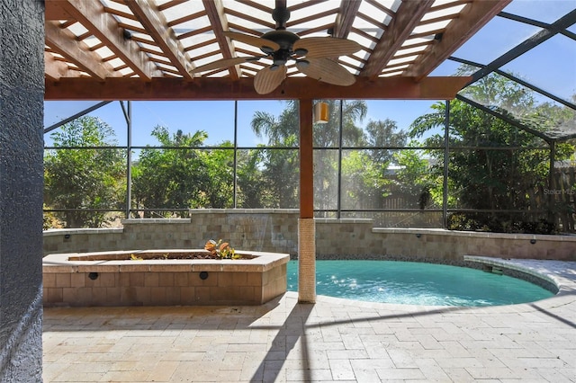 view of swimming pool featuring ceiling fan and a patio area