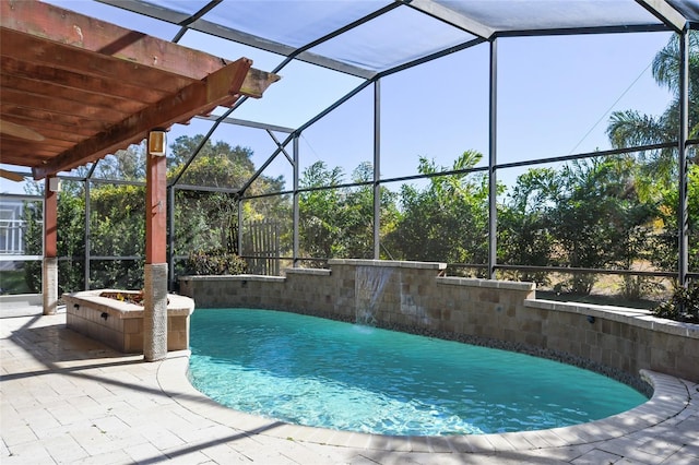 view of pool with pool water feature, glass enclosure, a pergola, and a patio