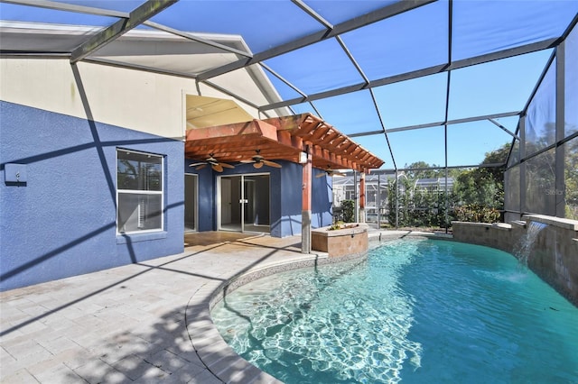 view of swimming pool featuring pool water feature, a patio area, a lanai, a pergola, and ceiling fan