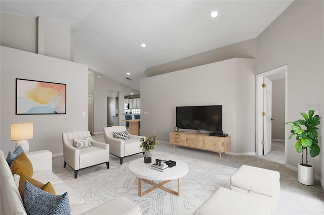 carpeted living room with vaulted ceiling