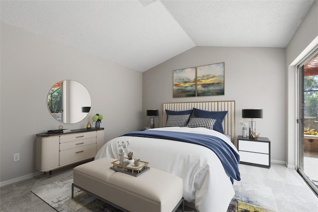 carpeted bedroom with vaulted ceiling and a textured ceiling