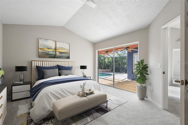 carpeted bedroom featuring access to outside, a textured ceiling, and vaulted ceiling