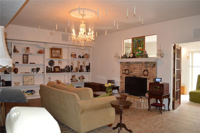 living room featuring a brick fireplace and a notable chandelier