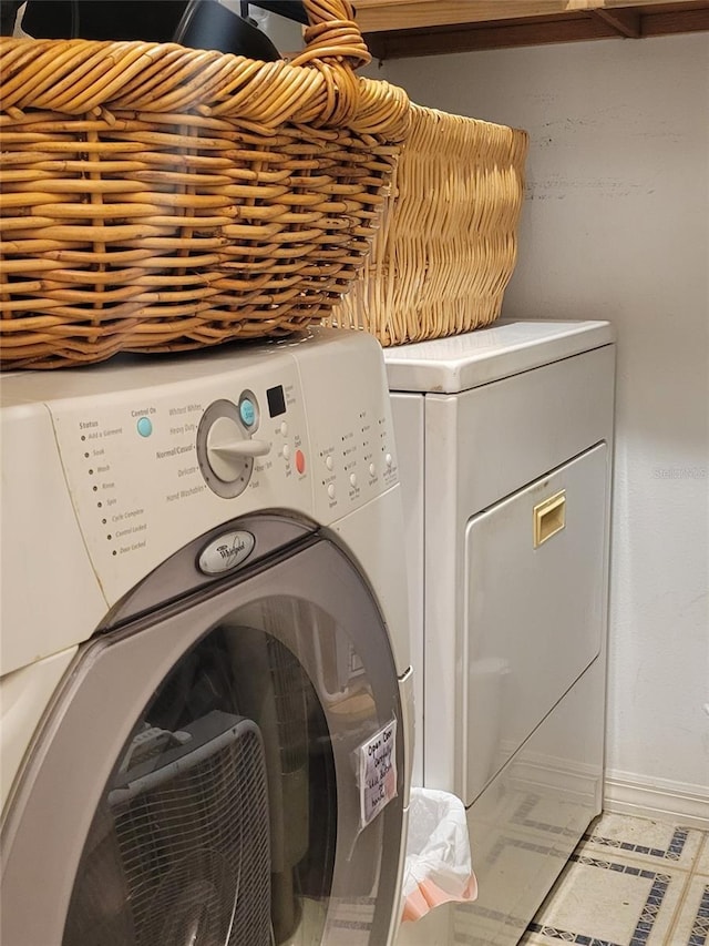 laundry room with separate washer and dryer