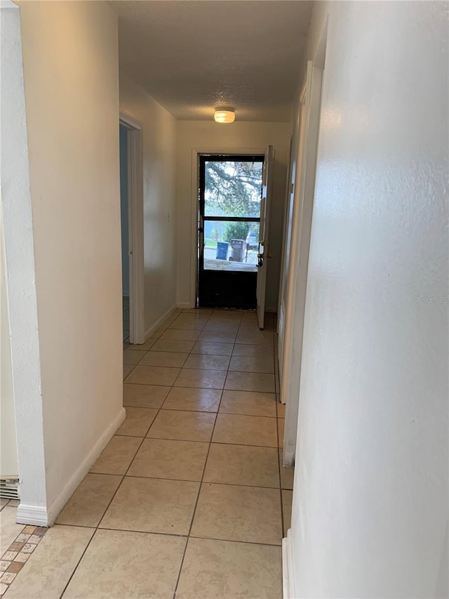 hallway with light tile patterned flooring