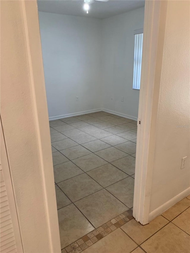 unfurnished room featuring light tile patterned floors