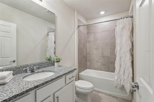 bathroom with tile patterned flooring, toilet, vanity, visible vents, and shower / bathtub combination with curtain