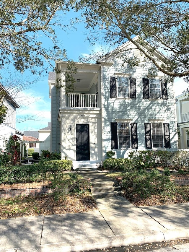 view of front of property with a balcony