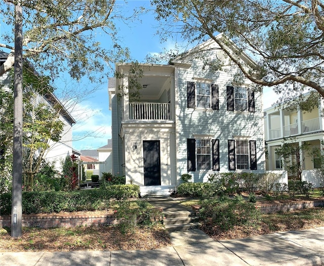 view of front facade with a balcony