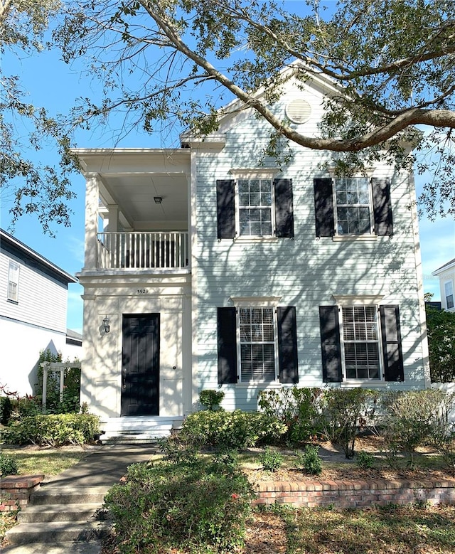 view of front of home with a balcony