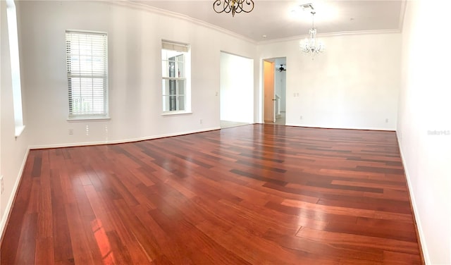 unfurnished room featuring hardwood / wood-style flooring, a chandelier, and ornamental molding