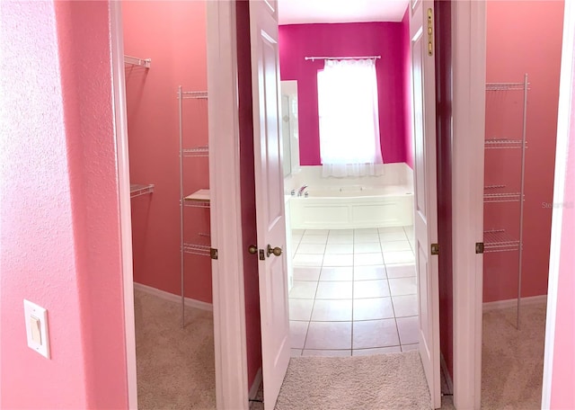 hall featuring light tile patterned flooring