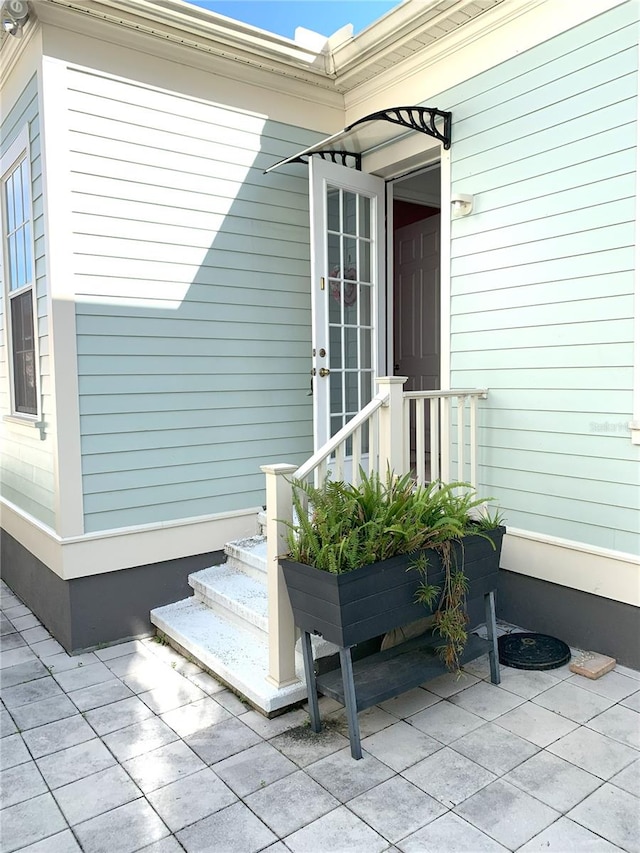 entrance to property with a patio