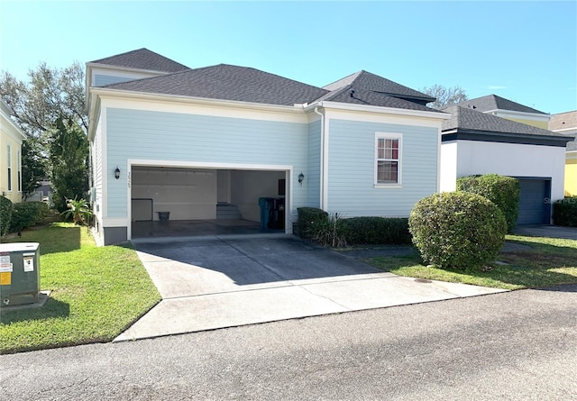 view of front of home featuring a garage and a front yard