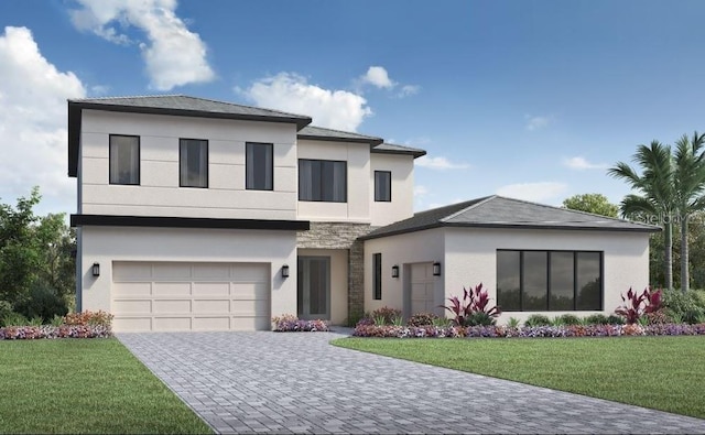 view of front of property featuring a garage and a front yard