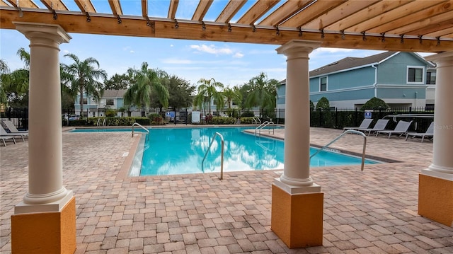 pool featuring a patio and fence