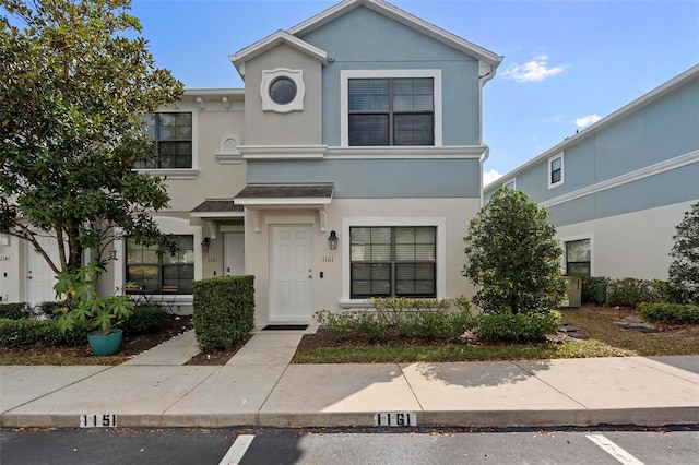 view of front of house featuring stucco siding