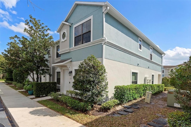 view of property exterior with stucco siding