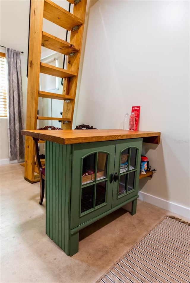 bar featuring green cabinetry