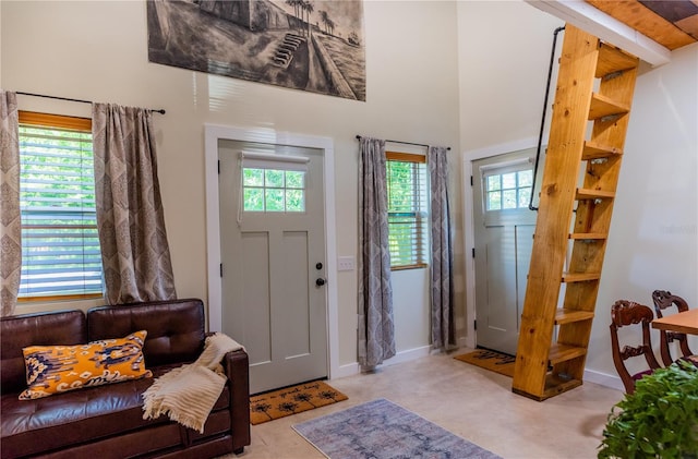 entryway with a towering ceiling