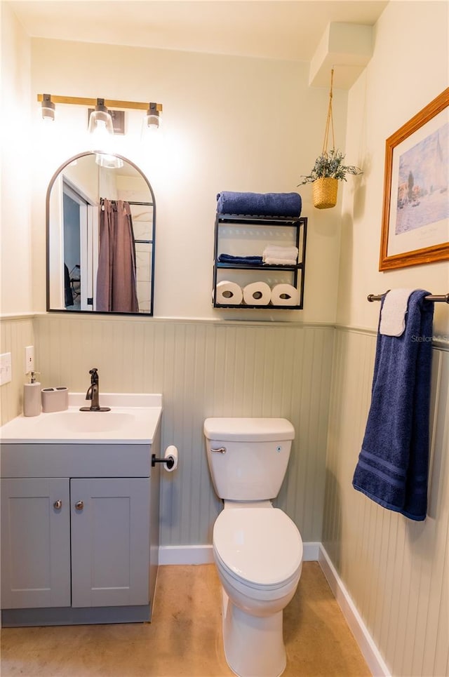 bathroom featuring vanity and toilet