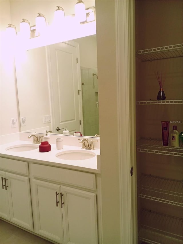 bathroom with vanity and walk in shower