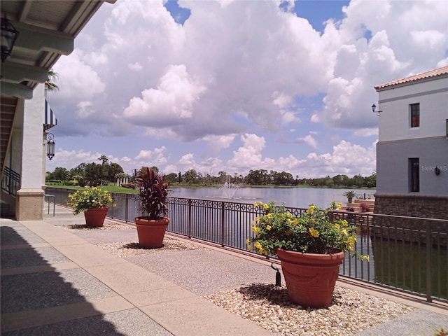 view of patio featuring a water view