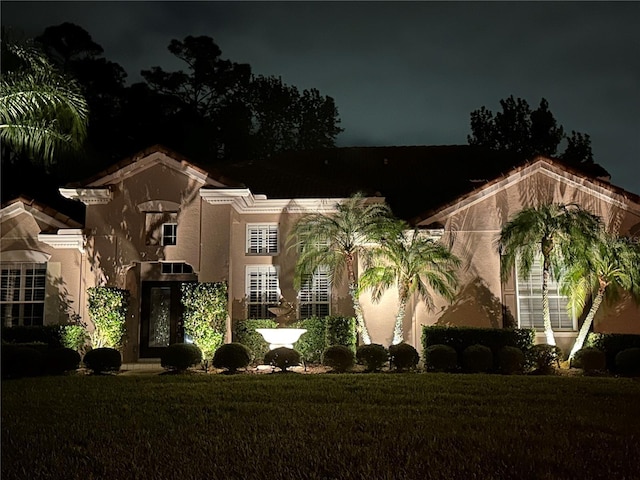 view of property at twilight