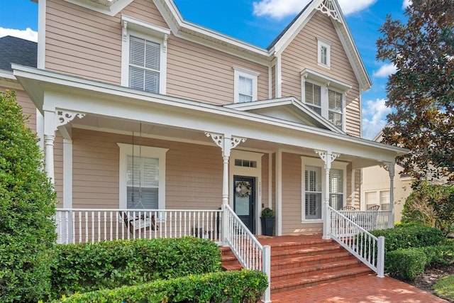 view of front of property featuring covered porch