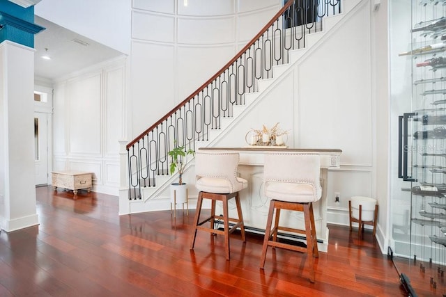 interior space featuring wood-type flooring and ornamental molding