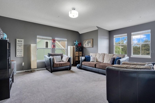 living room with light carpet and a textured ceiling