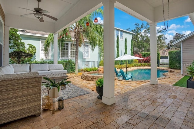 view of patio / terrace with an outdoor hangout area, a fenced in pool, and ceiling fan